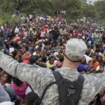 ives_disciplining-relief-by-us-solider_portauprince2010_picafp