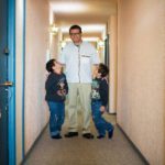 drury-martin-in-the-hallway-of-his-old-building-with-his-two-sons