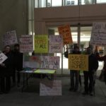Picket outside city meeting, January 16, 2017
